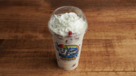 Fresh strawberries and sweet cream topped with whipped cream, served as a traditional Mexican dessert at Frosty Brothers in San Antonio.