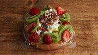 Frosty Cottage made with fresh strawberries, kiwi, grapes, cantaloupe, mango, cottage cheese, honey and pecans at Frosty Brothers Shaved Ice & Snacks in San Antonio, Texas.
