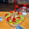 Fresh fruit bowl with strawberries, kiwi, grapes, cantaloupe, mango, creamy cottage cheese, honey and pecans prepared fresh daily at Frosty Brothers in San Antonio, TX.