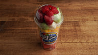 Fresh fruit cup with strawberries, cantaloupe, cucumber, watermelon, and pineapple, mango prepared daily at Frosty Brothers in San Antonio, TX.