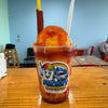 Authentic mangonada made with mango shaved ice, chamoy, Tajín, fresh mango, and a tamarind candy straw at Frosty Brothers in San Antonio.