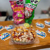 Traditional Mexican Tostilocos made with chips, cucumber, jicama, peanuts, Japanese peanuts, chamoy, lime, and Mexican candy at Frosty Brothers.